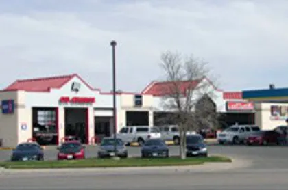 A Toot'n Totum store with a car wash and oil change bay.
